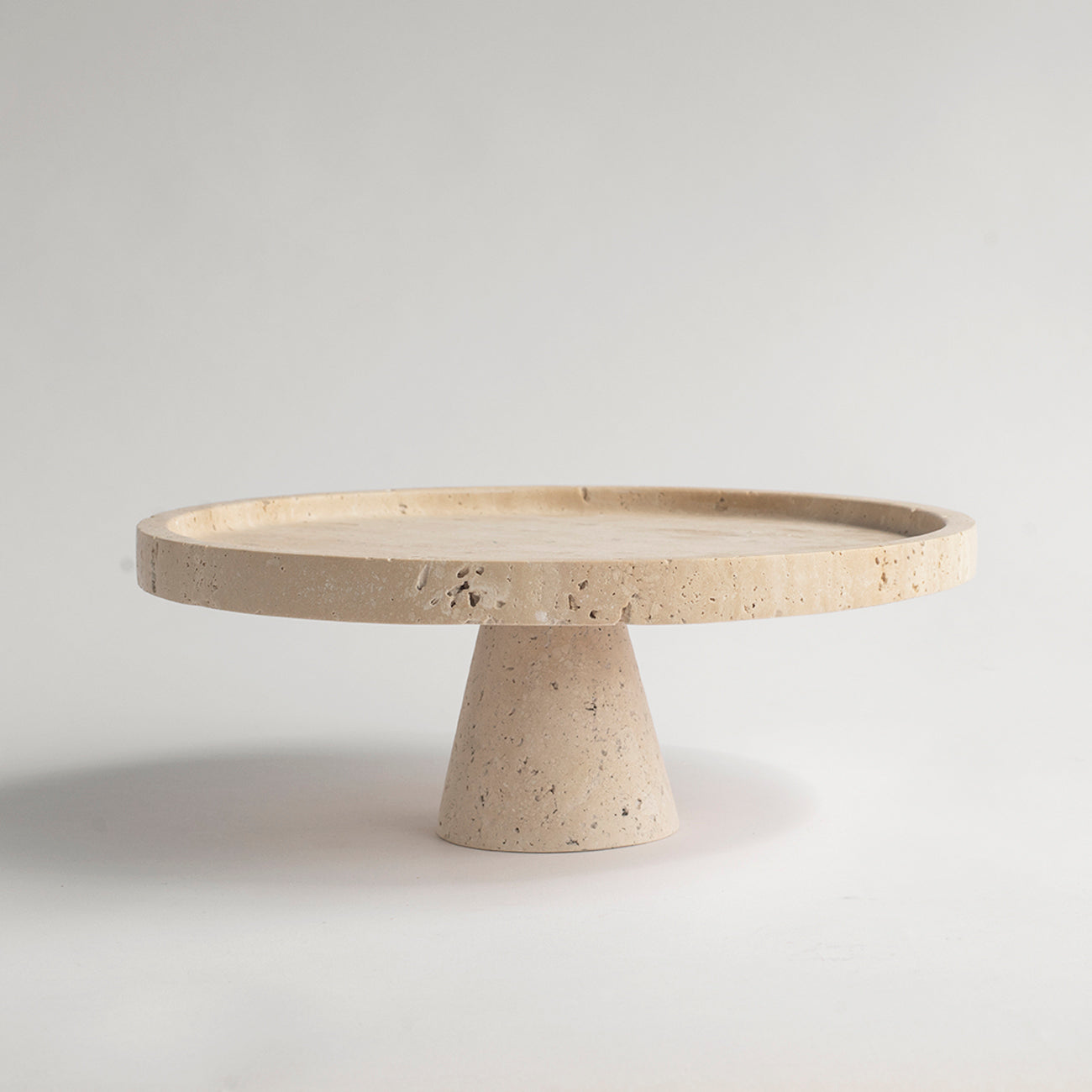 Travertine cake stand with natural stone base