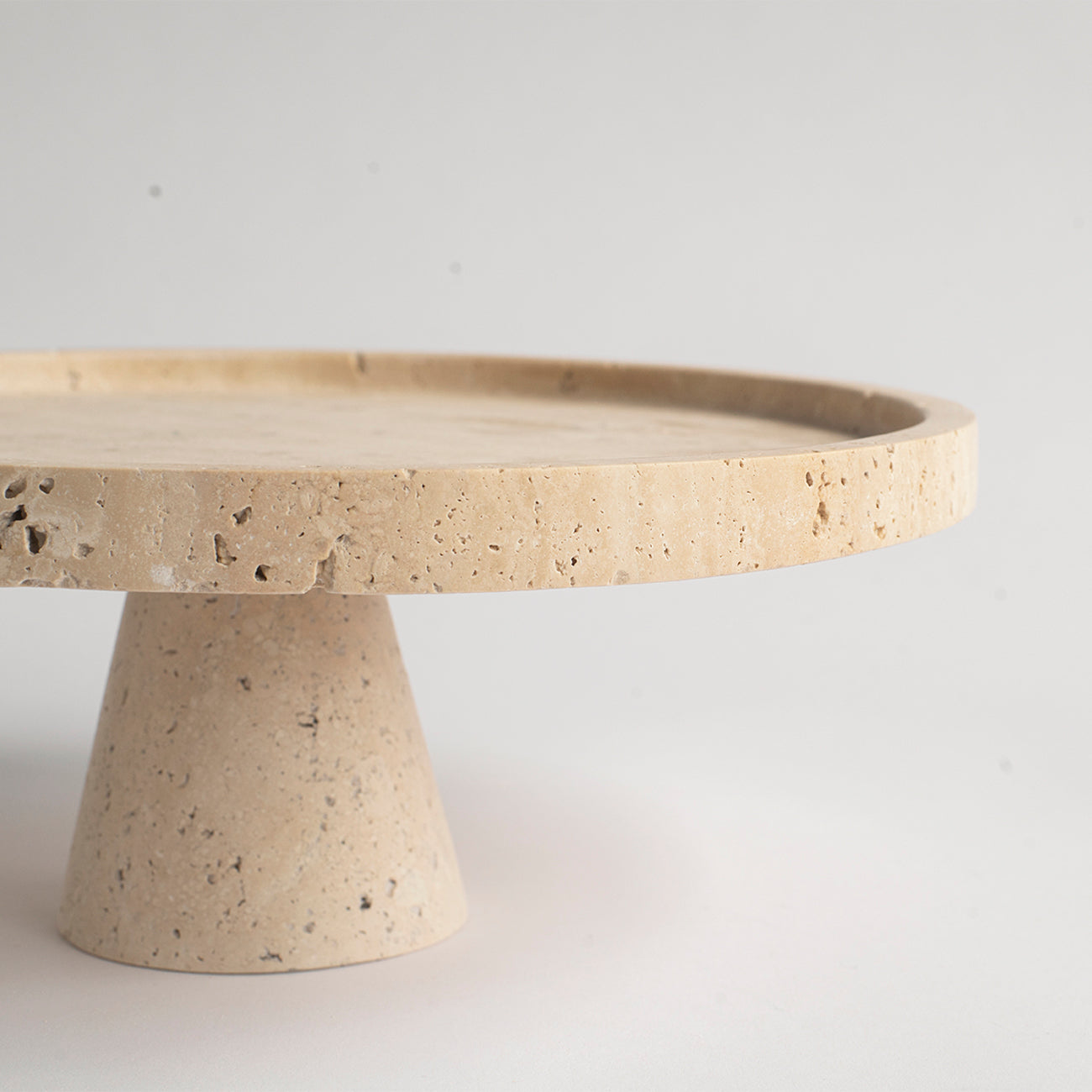 Travertine cake stand with natural stone base