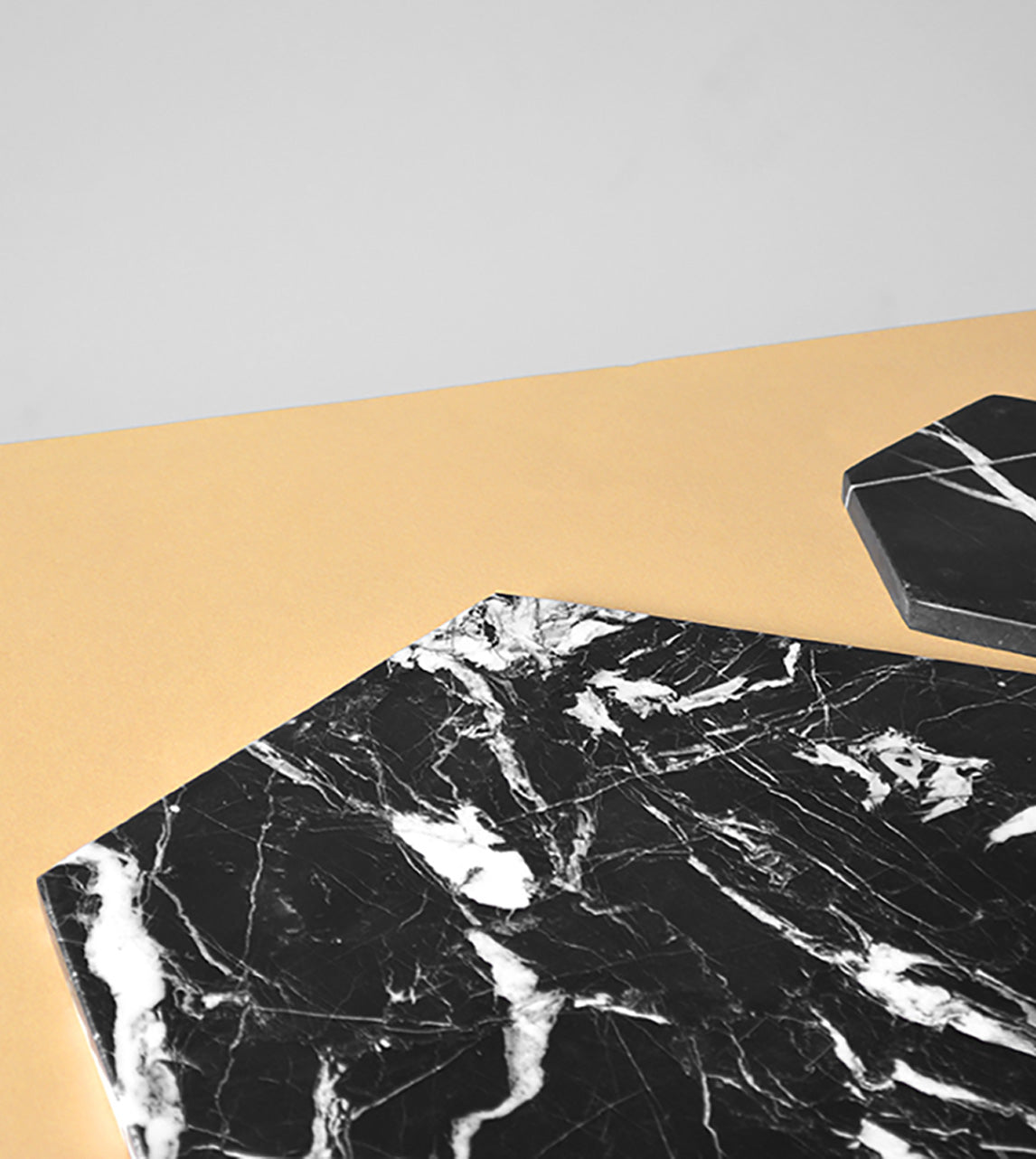 Black marble platter with hexagon shape for serving cheese