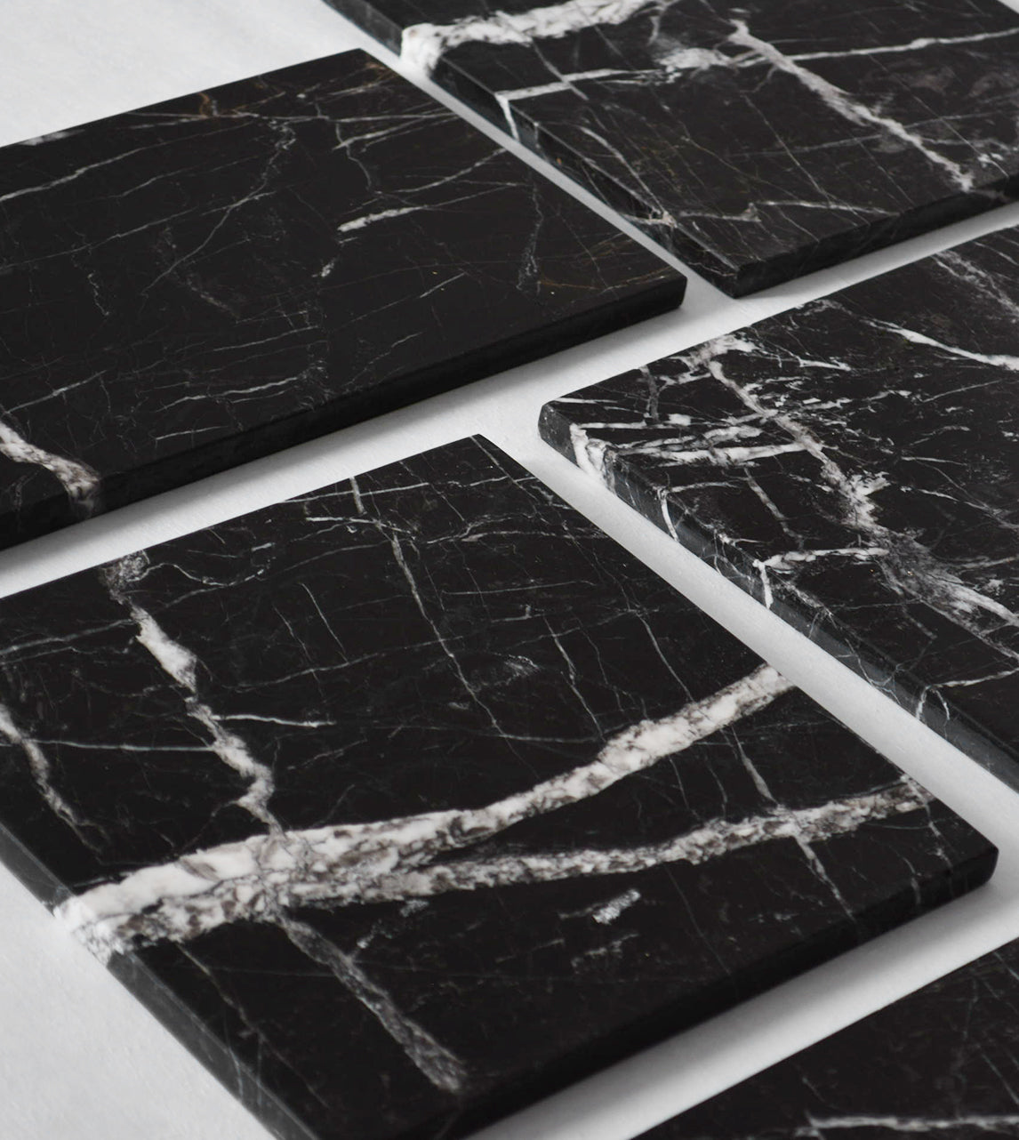 Black marble platter with white veining and square shape