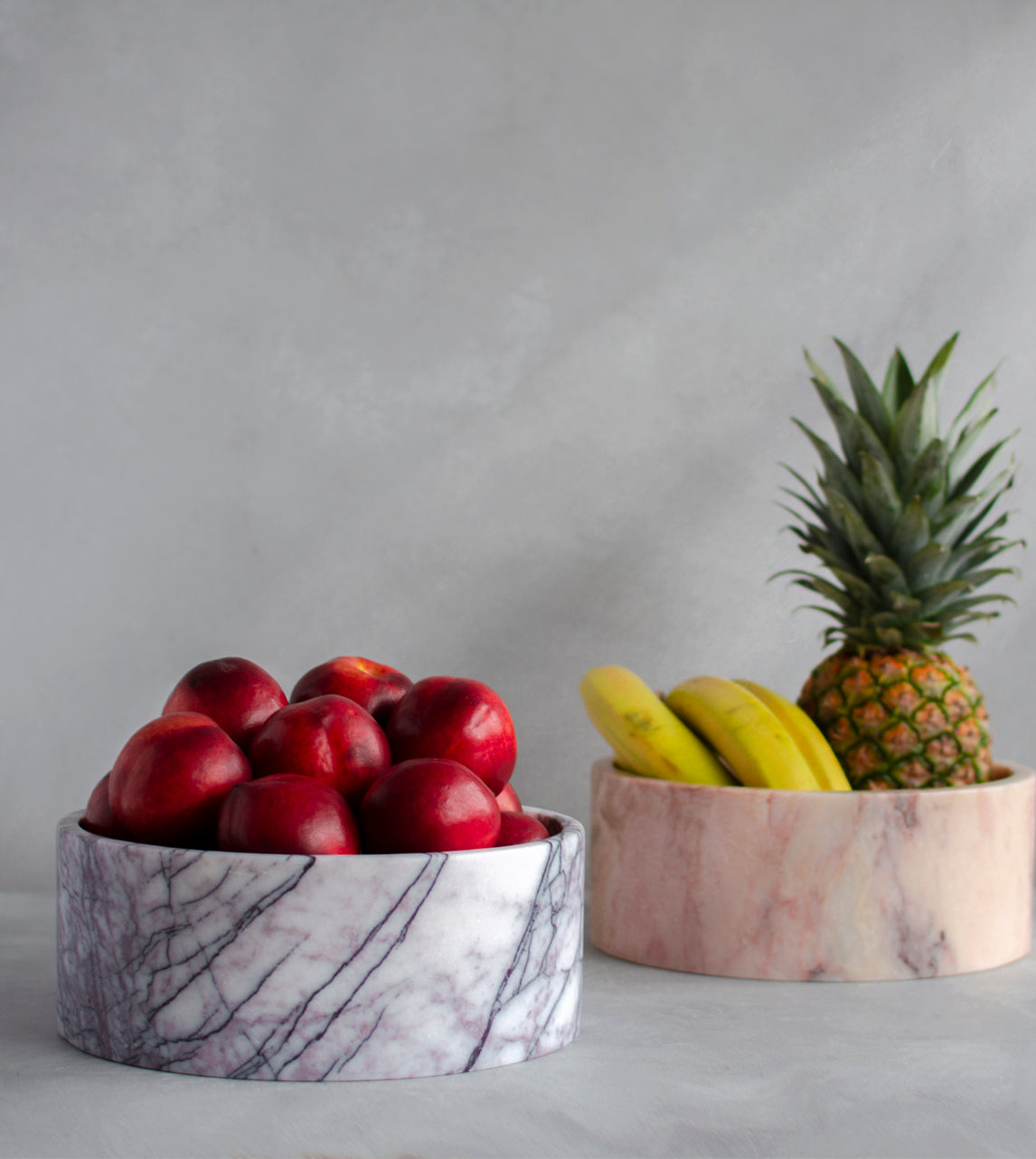 Lilac marble bowl used in travertine home decor setup