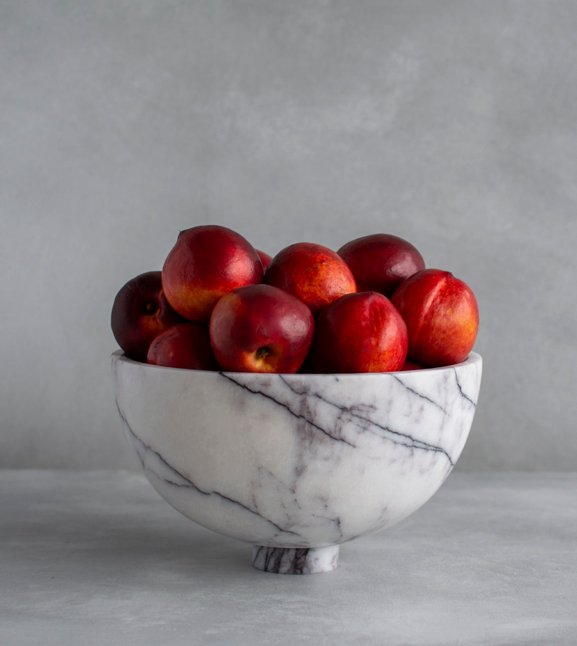 Lilac marble fruit bowl with pedestal and white veining