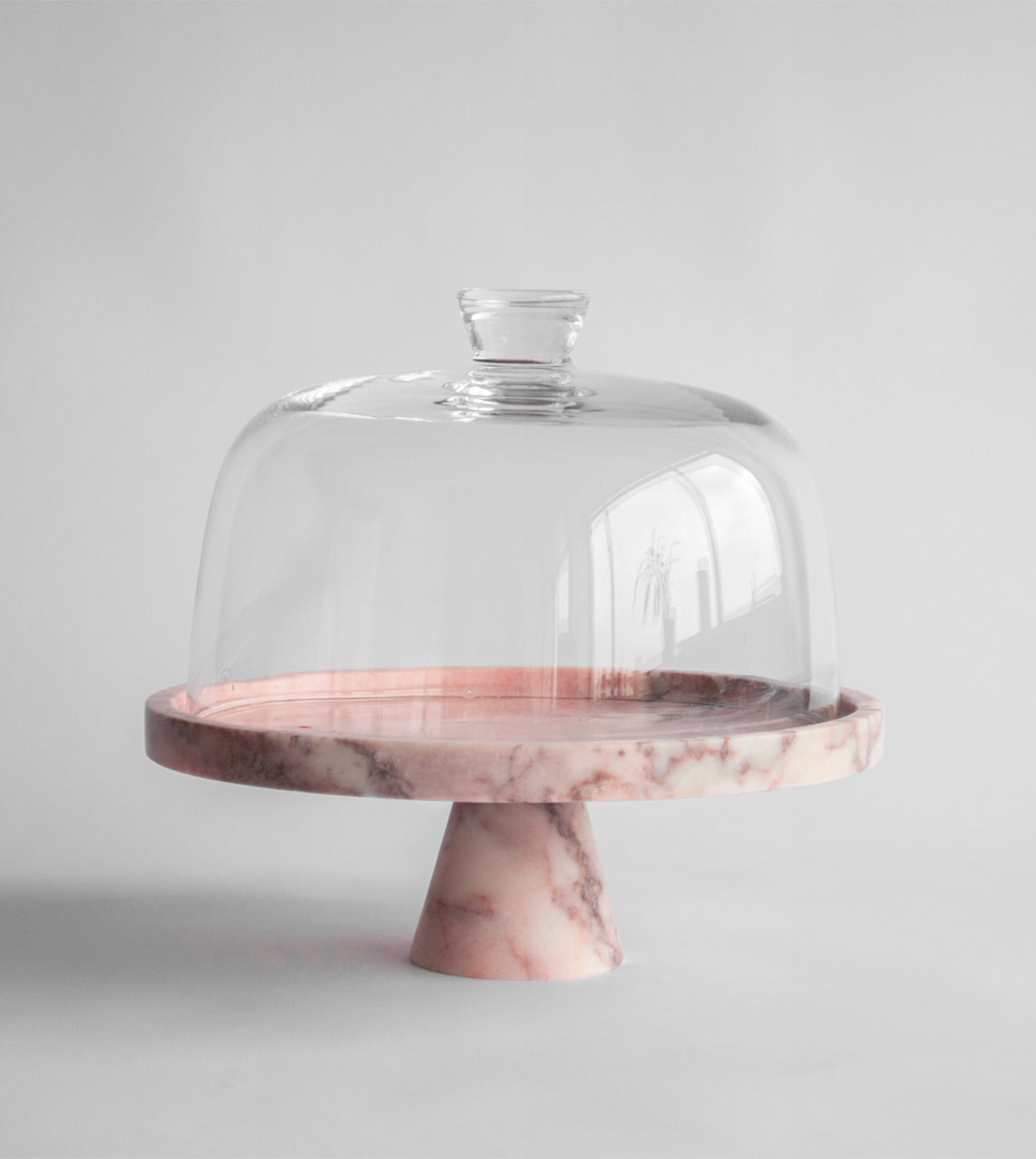 Pink marble pedestal cake stand with elegant design