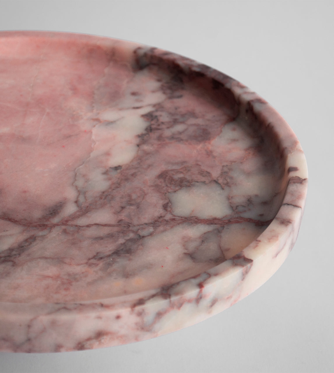 Pink marble pedestal cake stand with elegant design