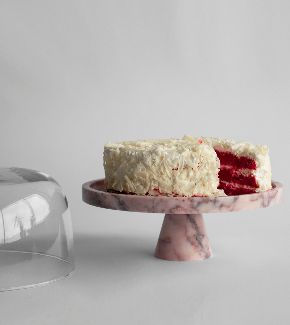 Pink marble pedestal cake stand with elegant design