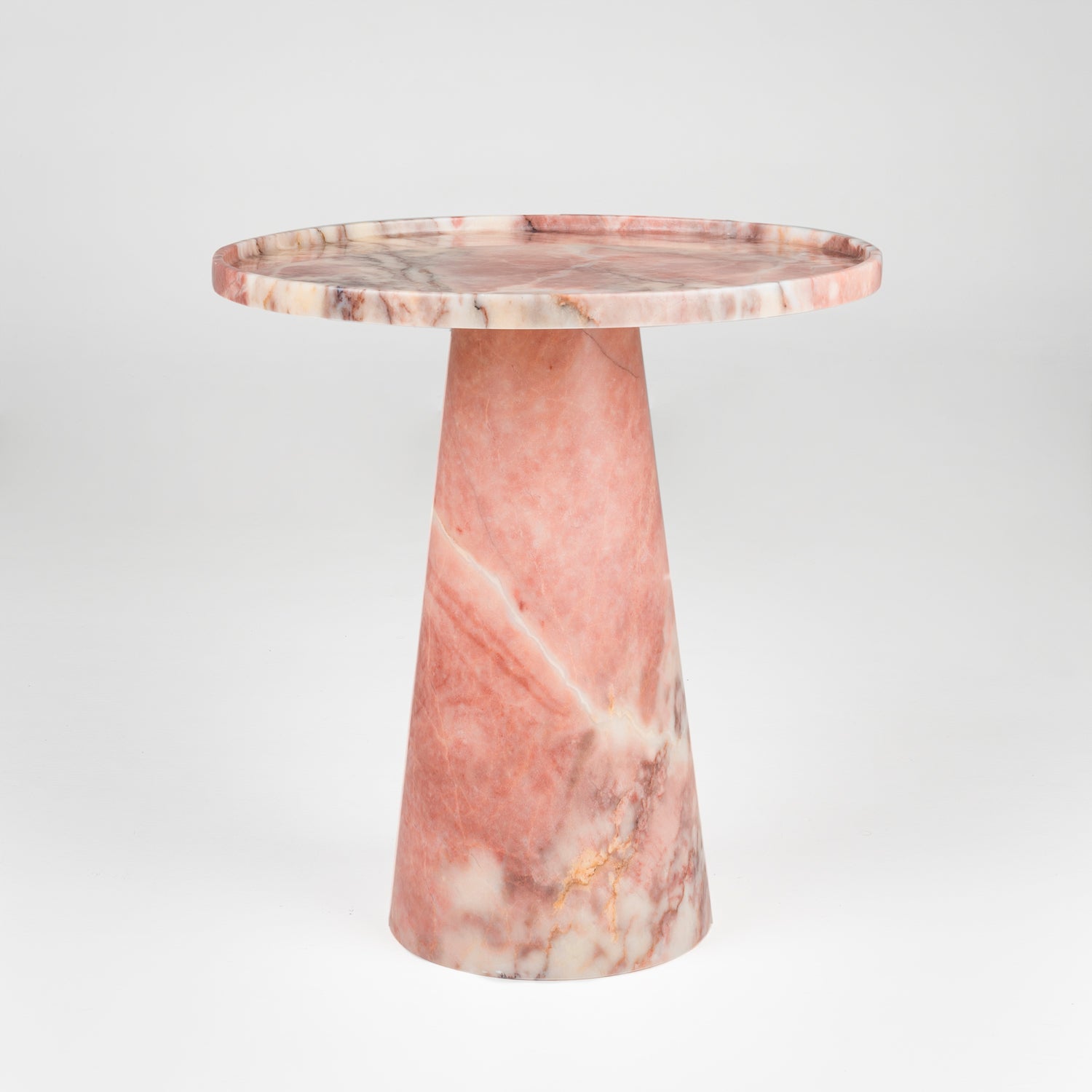 Pink marble cone side table with soft veining and round top