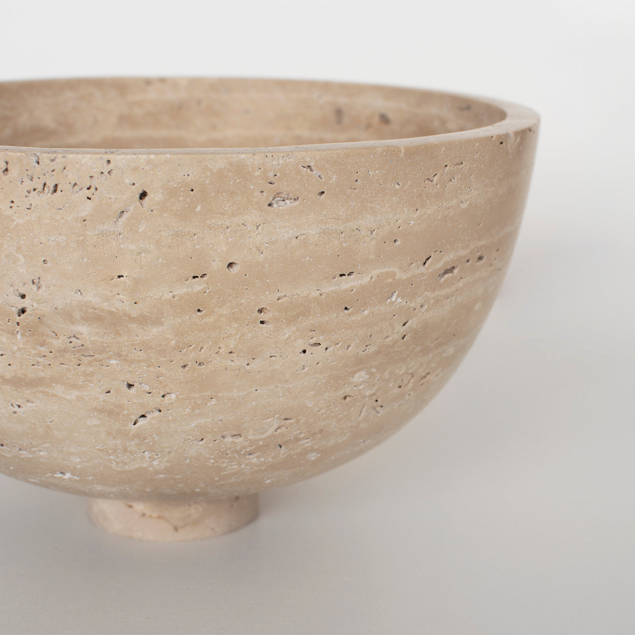 Travertine fruit bowl centerpiece with natural stone detail